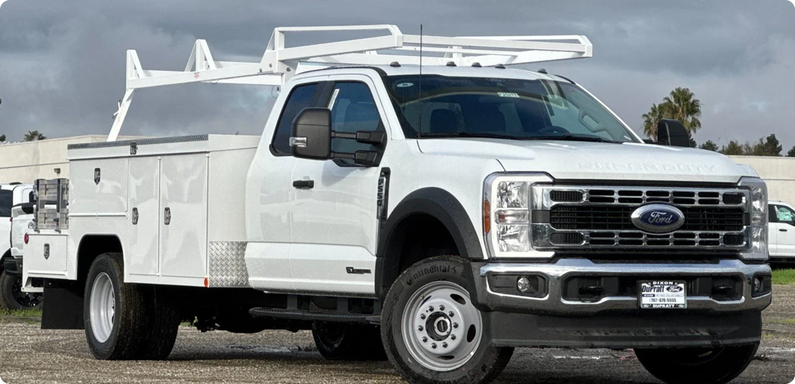 White utility truck with service bed
